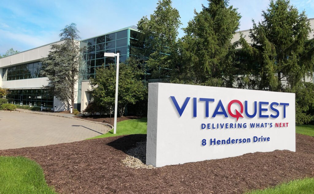 The exterior of Vitaquest's headquarters building with the company signboard at 8 Henderson Drive.